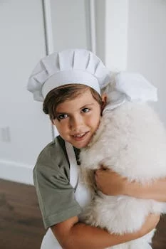 maria gonzalez chef owner smiling in kitchen